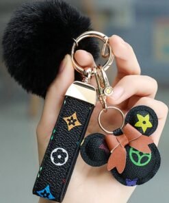 KeyAmor Black keychain with elegant fluffy fur for women A great option as a gift Plaid leather and golden metal keychain includes matching accessories