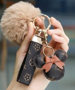 KeyAmor Dark brown  keychain with elegant fluffy fur for women  A great option as a gift  Plaid leather and golden metal keychain includes matching accessories