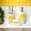 The Transit Story Premium Ceramic Bathroom Accessories Set of 3 | Modern Hand-Painted Bath Set with 300ml Soap Dispenser, Toothbrush Holder & Soap Dish | Bathroom Items | White & Yellow Floral Pattern